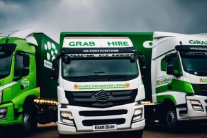Grab Hire | Three green and white trucks parked in a parking lot.