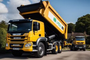 Grab Hire | Two yellow dump trucks driving down a country road.